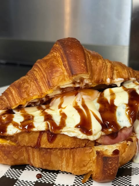 Loaded golden croissant served at Milk Money Espresso